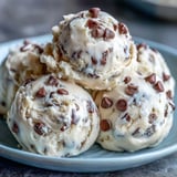 Spoonfuls of Greek Yogurt Cookie Dough showcase a scoopable, egg-free treat, with buttery sweetness and tangy yogurt notes.