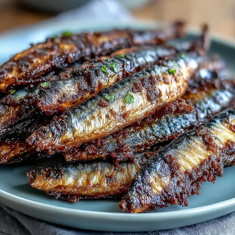 Golden catfish fillets fried to perfection, served hot with tangy remoulade sauce for an authentic soul food dinner.